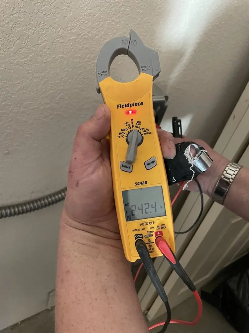 Voltage testing with clamp meter during Whole House Surge Protector in Junction City
